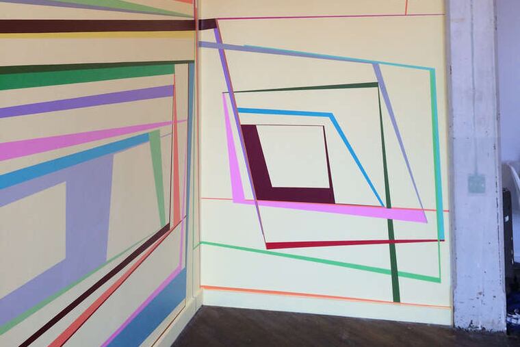Gary Petersen's "zip line tow rope," colorful rectangles and parallelograms on two walls, is at Tiger Strikes Asteroid.