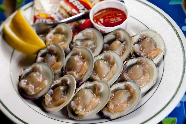 A dozen cold littleneck clams on the half shell served at the Clam Bar, the straight-ahead, no-frills seafood shack in Somers Point, known as Smitty's.