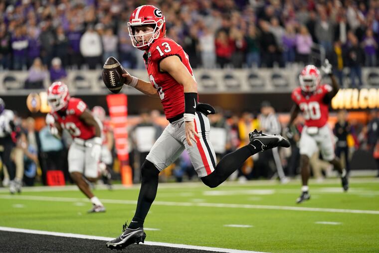 Georgia quarterback Stetson Bennett (13) runs into the end zone for a touchdown against TCU during the first half of the national championship NCAA College Football Playoff game, Monday, Jan. 9, 2023, in Inglewood, Calif.