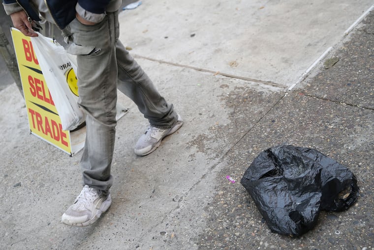 A discarded plastic bag is pictured along Kensington Avenue near McPherson Square in Philadelphia on Saturday, Nov. 9, 2019.