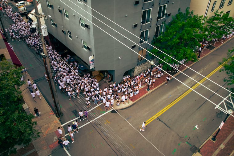 A line for Doggie's Pub in State College stretches down Pugh Street and into Calder Way. LineLeap, a $100 million start-up that has partnered with almost every downtown bar in the college town, allows users to skip lines like these at a price ranging from $10 to $100 or more, depending on demand.