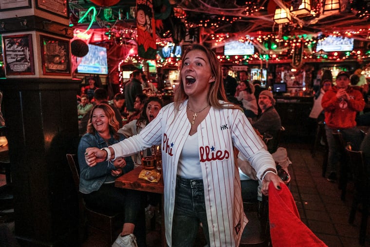 Bella Tierce watches as the Phillies' Kyle Schwarber homers in the 6th inning against the Padres at McGillin's Olde Ale House on Tuesday.