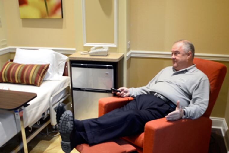 At the Genesis PowerBack rehab facility in Voorhees, William G. Burris Jr. demonstrates a recliner. (Tom Gralish / Staff Photographer)