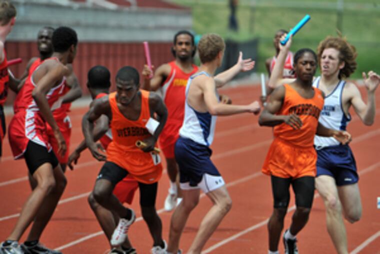 Batons are passed off for the anchor leg of the Class AAA 4x800 relay. Dobbins' Paul Catchings, Jermaine Leslie, Dominique Robinson and Jonathan Holland won the event in 8:44.01.