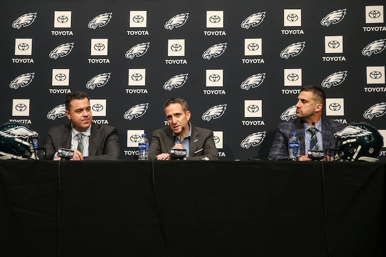 Eagles VP Andy Weidl (left), executive VP and general manager Howie Roseman (center), and head coach Nick Sirianni talking on draft night.