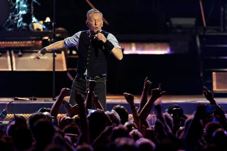 Bruce Springsteen performs with the E Street Band during their "Land of Hope and Dreams" tour stop at Xfinity Mobile Arena in Philadelphia on Saturday.