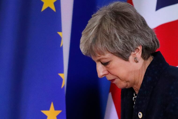 British Prime Minister Theresa May leaves after addressing a media conference at an EU summit in Brussels, Friday, March 22, 2019. Worn down by three years of indecision in London, EU leaders on Thursday were grudgingly leaning toward giving the U.K. more time to ease itself out of the bloc.