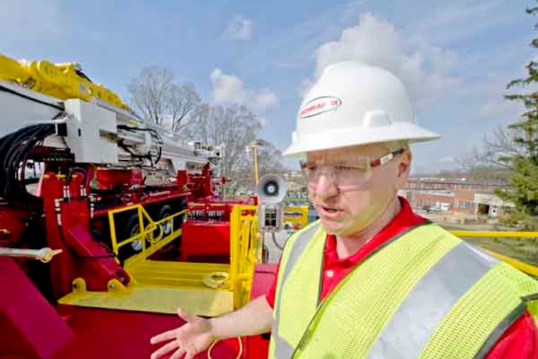 Schramm, Inc., engineering manager Dave Hartzell talks about the new T500XD rig, set up in the middle of the company's 27 acre campus in West Chester April 10, 2013. The T500XD rises 102 feet above ground and is capable of drilling long horizontal shale wells. ( CLEM MURRAY / Staff Photographer )