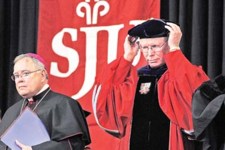 Presidential Inauguration of C. Kevin Gillespie, the 27th President of Saint Joseph's University. Photograph from start of inauguration ceremony held in Hagan Arena on Friday morning October 12, 2012. At left is Archbishop of Philadelphia, Most Reverend Charles J. Chaput and at right C. Kevin Gillespie, the 27th President of Saint Joseph's University. ( ALEJANDRO A. ALVAREZ / STAFF PHOTOGRAPHER )