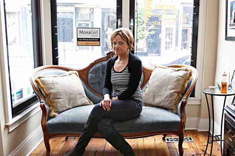 Julie Ebner poses in her shop, Juju Spa, in Queen Village on May 7, 2013. (DAVID MAIALETTI / Staff Photographer )