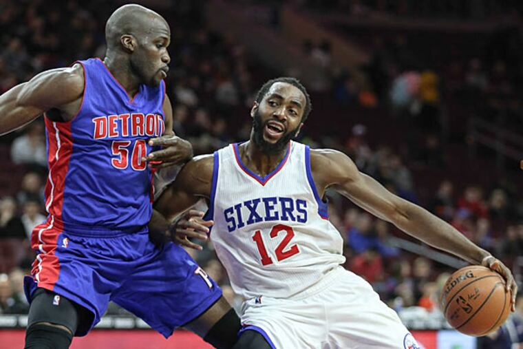 Sixers' Luc Richard Mbah a Moute drives on Pistons' Joel Anthony during the 1st quarter at the Wells Fargo Center in Philadelphia, Wednesday, March 18, 2015. (Steven M. Falk/Staff Photographer )