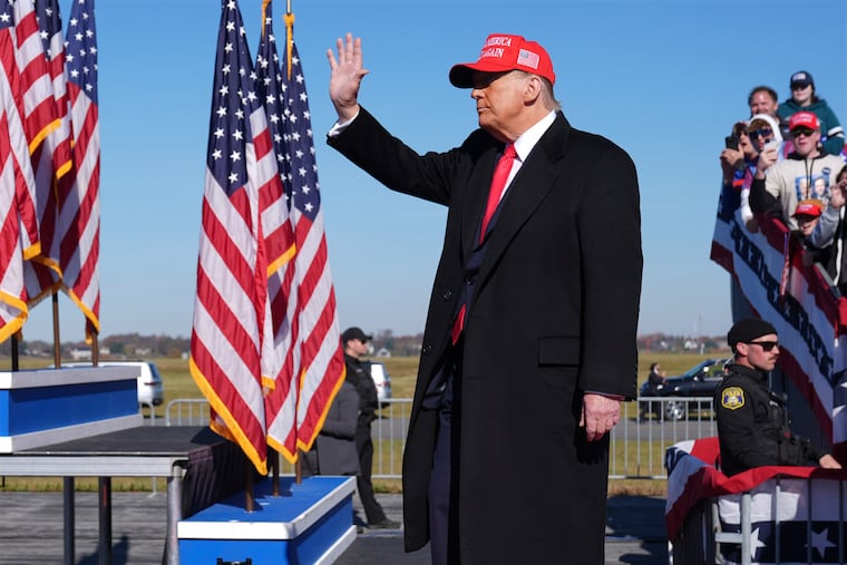 Republican presidential nominee former President Donald Trump waves at a campaign rally in Lititz, Pa., Sunday.