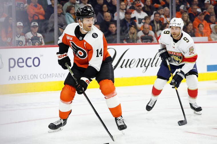 Flyers center Sean Couturier skates with the puck against Florida Panthers center Sam Bennett on Monday, Oct. 13, 2025 in Philadelphia.