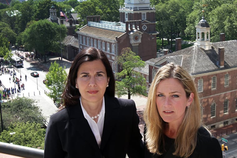 Assistant US attorneys Michelle Morgan, left, Michelle Rotella, right, outside their offices near Independence Hall in Philadelphia on May 20, 2014.