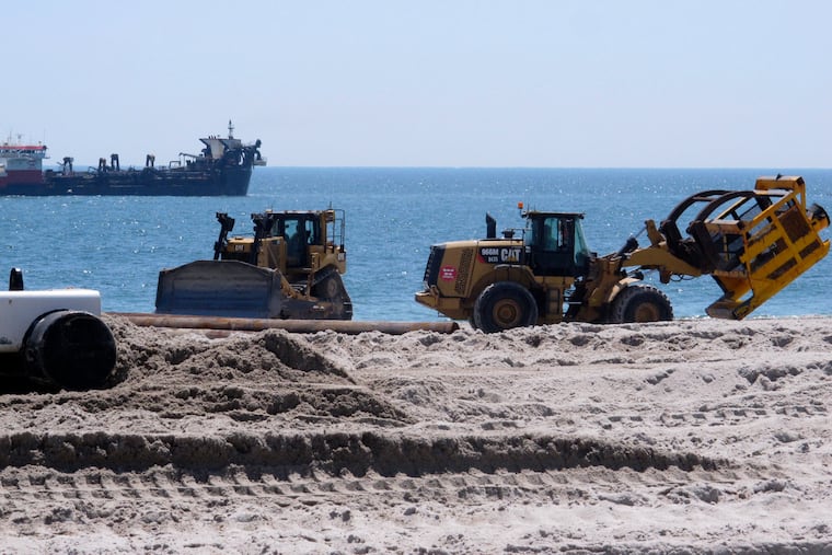 Beach replenishment work takes place in Brick, N.J., on July 11, 2018. (AP Photo/Wayne Parry)