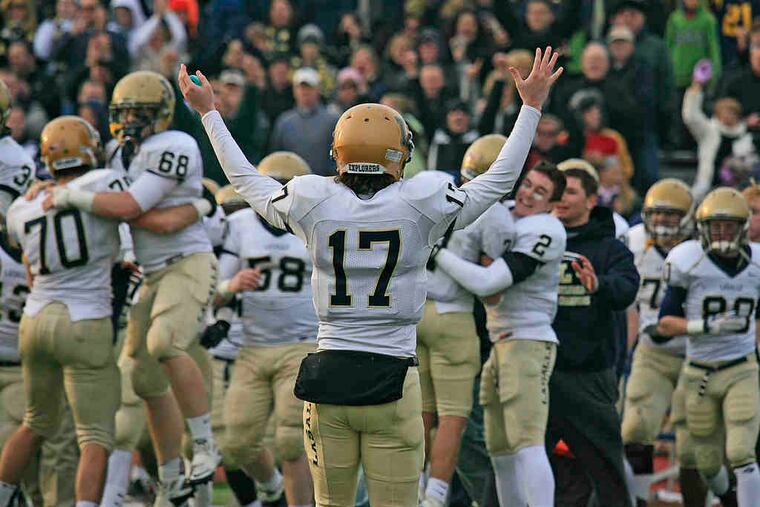 La Salle quarterback Matt Magarity (17) leads the postgame cheers as the Explorers celebrate a return to the state championship game Saturday. Magarity threw two touchdown passes in the wild semifinal, as neither team backed down the whole way.