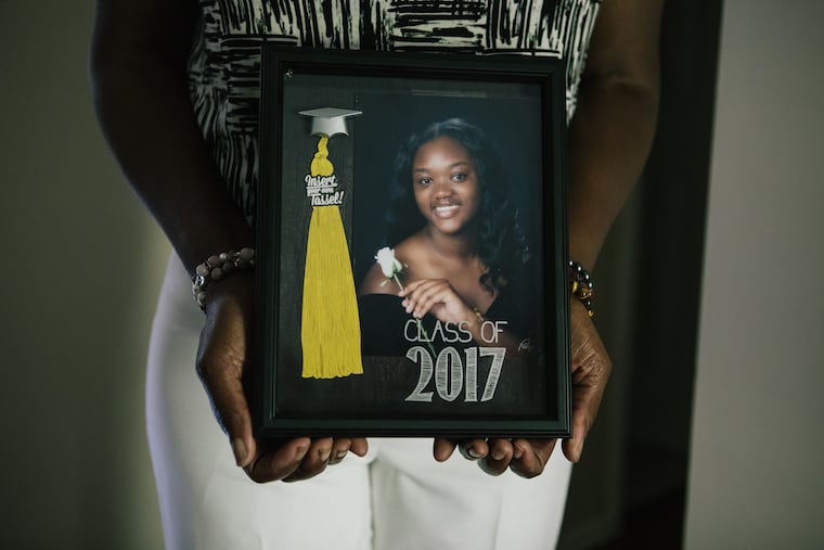 Michelle Roberson holds a photograph of her daughter Bianca, who was murdered at age 17 by a white man in 2017.