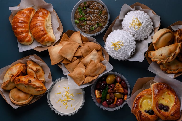 Assorted dishes from Jezabel Careaga, including empanadas, medialunas, escabeche, ricotta cake, facturas, olive oil crackers and preserved lemon labneh.