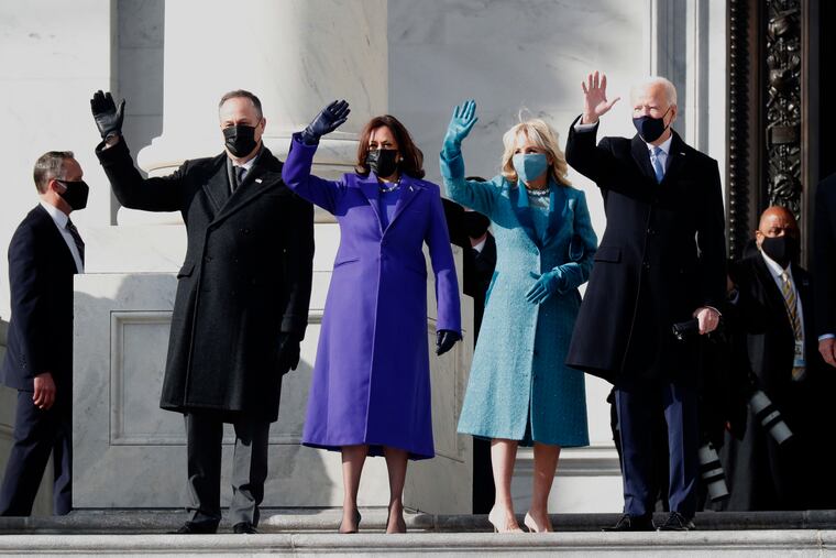 President Joe Biden (right), with first lady Jill Biden (second from right), Vice President Kamala Harris (second from left), and her husband, Douglas Emhoff, arrive on the East Front of the U.S. Capitol on Wednesday.
