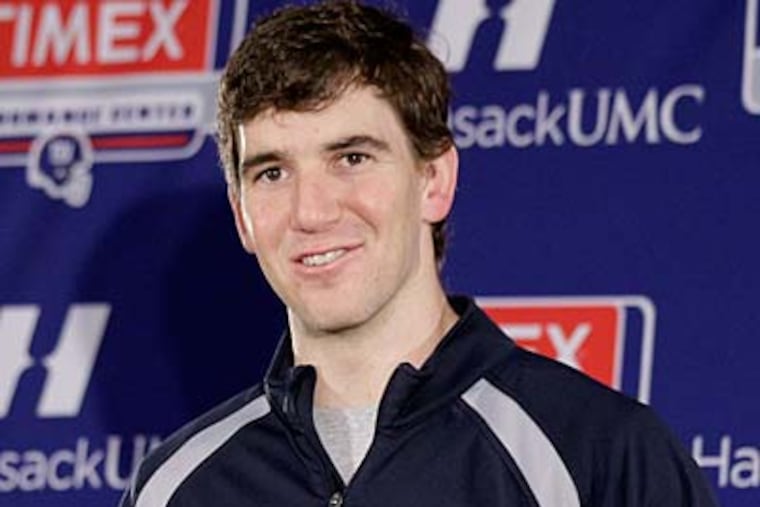 Eli Manning can add a second Super Bowl victory to his resume with a win on February 4. (Julio Cortez/AP)