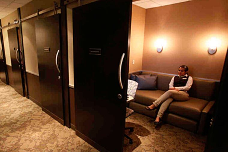 Angie Alfonso, 19, a Temple student majoring in tourism and hospitality, works at Minute Suites. (Michael S. Wirtz/Staff Photographer)