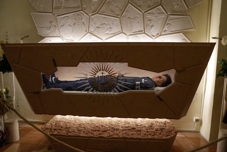 15-year-old Carlo Acutis, an Italian boy who died in 2006 of leukemia, lies in state ahead of being beatified by Cardinal Agostino Vallini, in Assisi, Italy, on Oct. 10, 2020.