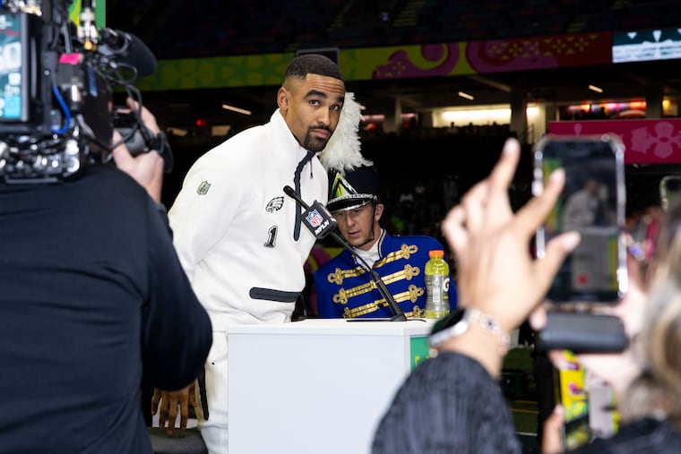 Eagles quarterback Jalen Hurts takes his seat at a podium during Super Bowl LIX Opening Night on Monday at the Caesars Superdome.
