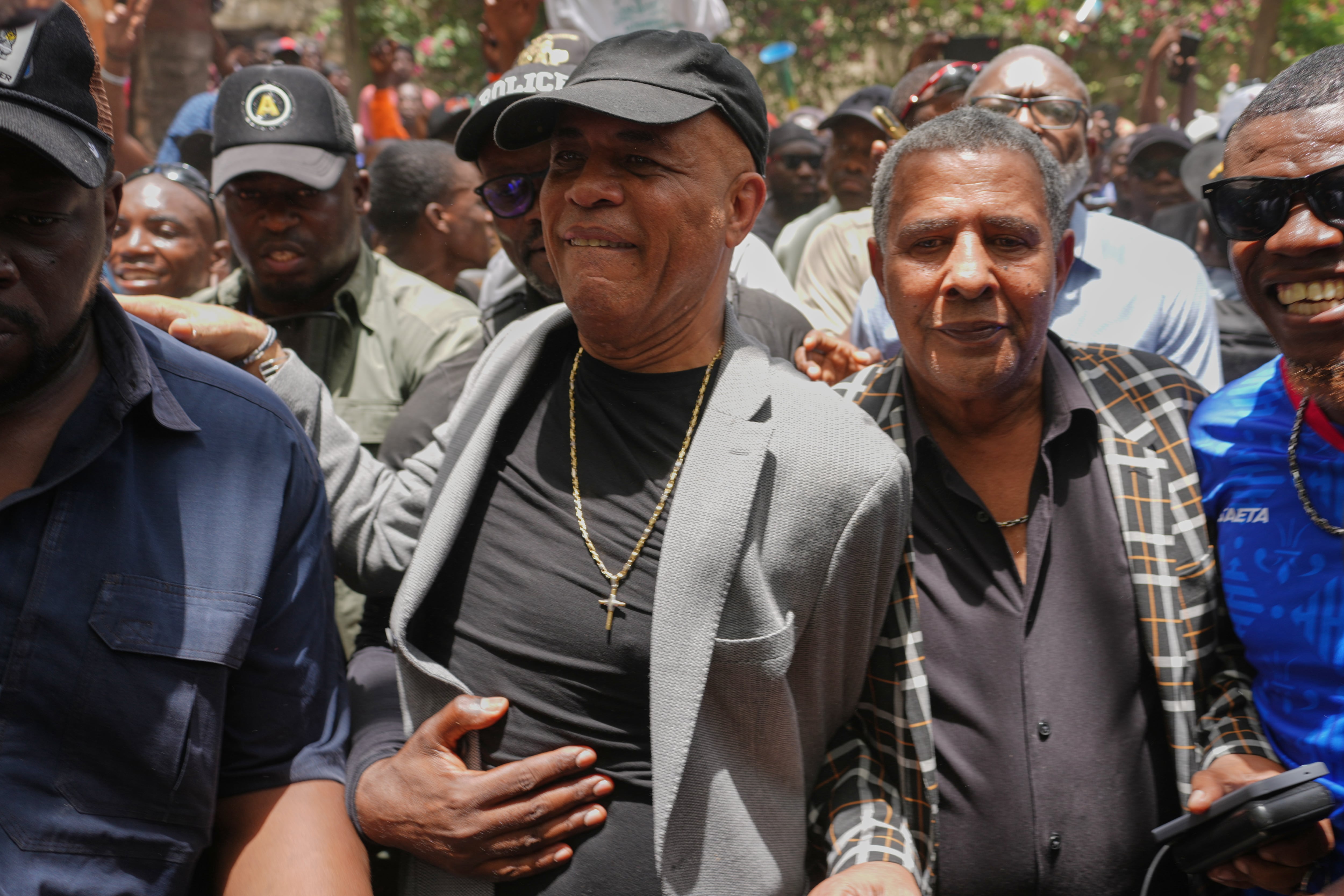 Sanctioned former President Michel Martelly returns to Haiti as some cheer