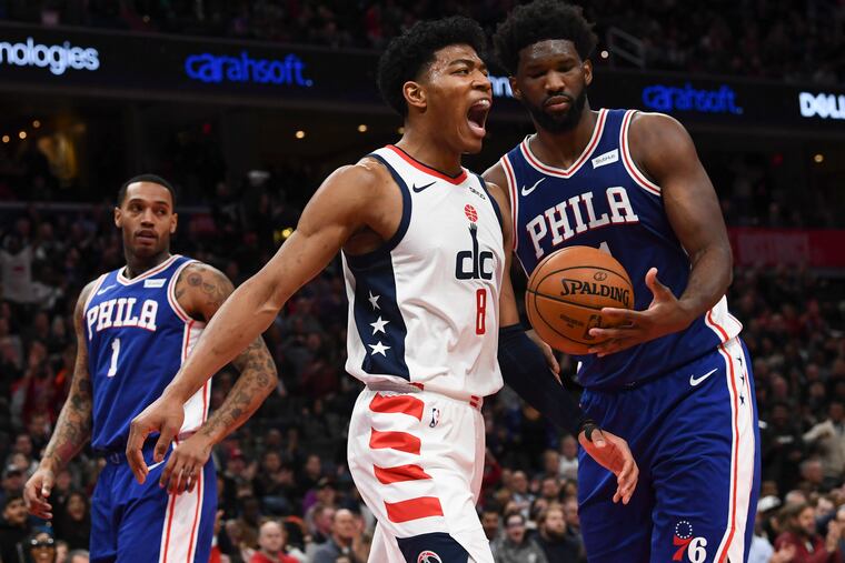 Washington Wizards forward Rui Hachimura celebrates a dunk against the 76ers at Capital One Arena.