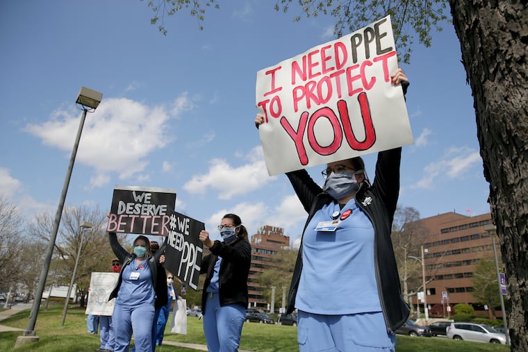 Carly Heller, an ICU nurse at Einstein, (at right) and her coworkers sought community support outside Einstein Medical Center in April. Now, nurses at Einstein and three other hospitals are fighting for minimum staffing levels.