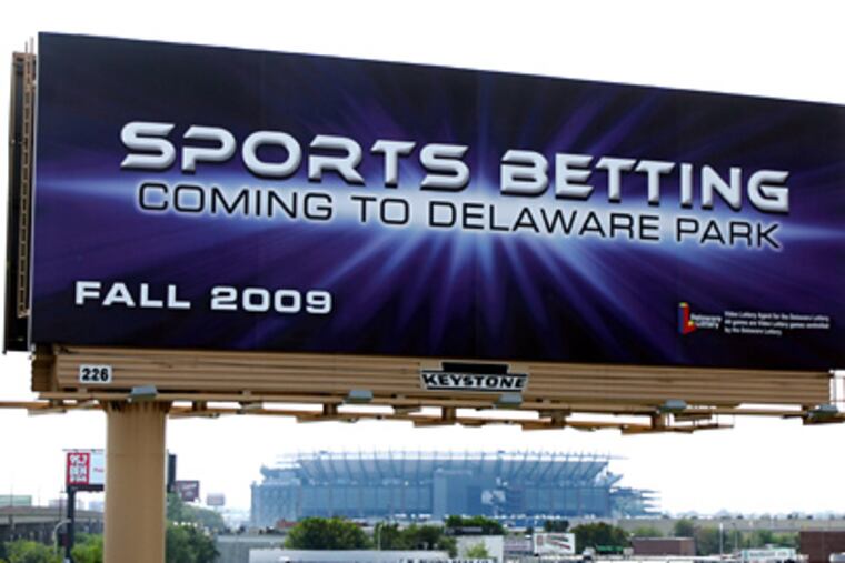 A billboard advertises sports betting in Delaware to drivers traveling southbound on I-95 in South Philadelphia. (David Swanson / Staff Photographer)