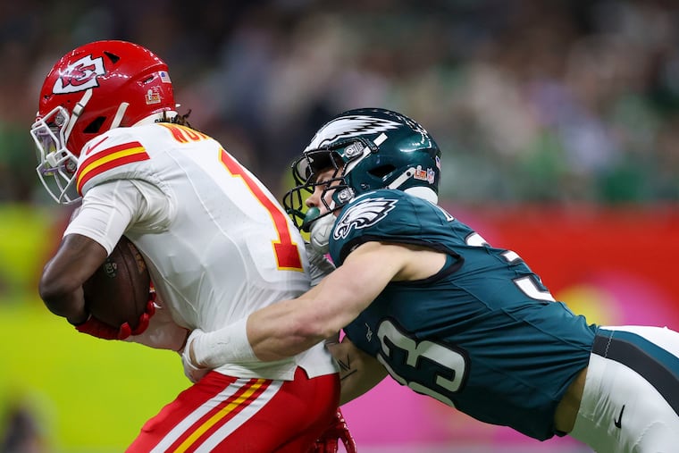 Eagles cornerback Cooper DeJean tackles Chiefs wide receiver Xavier Worthy during Super Bowl LIX.