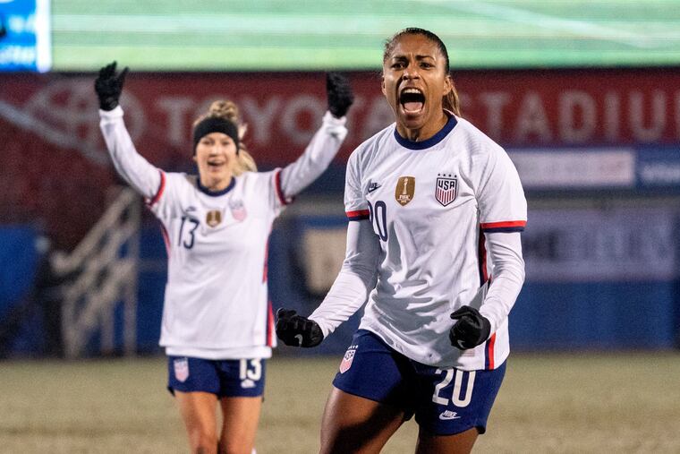U.S. forward Catarina Macario (20) and midfielder Ashley Sanchez (13) celebrate one of Macario's goals against Iceland.