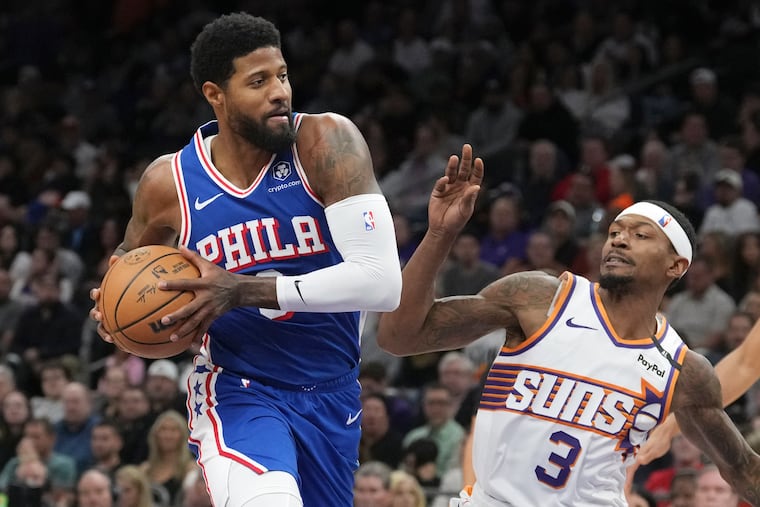 Sixers star Paul George (left) scored 15 points in his season debut against the Suns on Monday night.