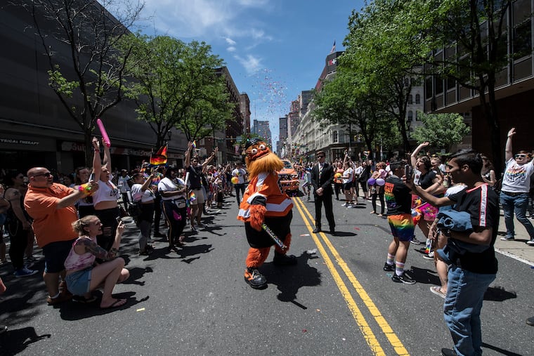 Gritty dances on Market Street during the Philadelphia Gay Pride Parade.