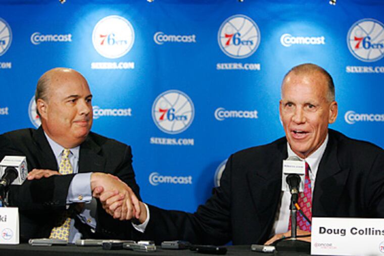 Ed Stefanski, left, shakes hands with new Sixers head coach Doug Collins. (Alejandro A. Alvarez / Staff Photographer)