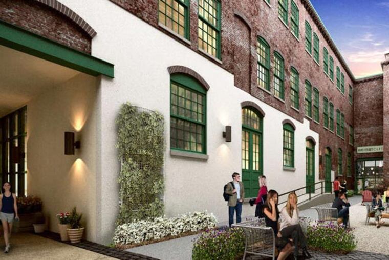 The Oxford Mills commercial tenants will have a shared open-air courtyard with cafe. The anchor tenant is Teach for America.