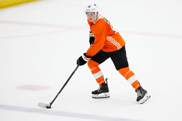 Alex Bump skates with the puck during a development camp scrimmage game at the Flyers Training Center on July 6.
