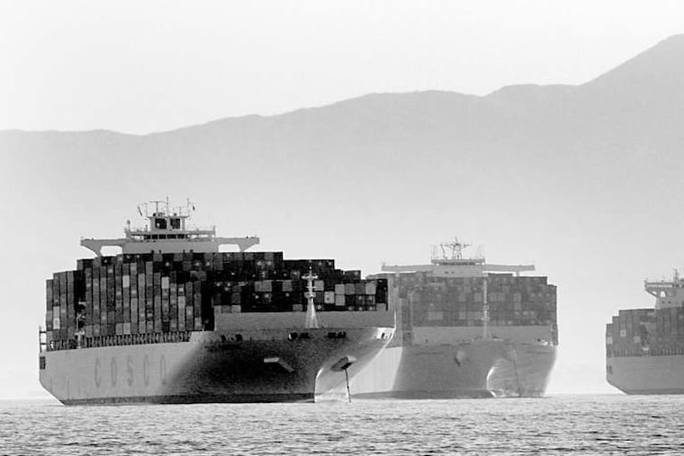 Container ships waiting to get into the Port of Long Beach on Wednesday off Long Beach, Calif. A contract dispute is delaying cargo operations.