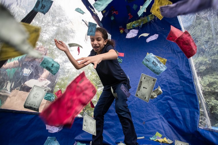 The Foundation for Delaware County is hosting Delco Gives day this week. At last year's closing party, Hidaya Jeddou tried to grab as much play money as she could to raise money for participating nonprofits.