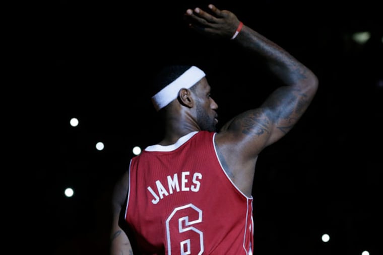 The Heat's LeBron James (6) stands on the court during team introductions before an NBA basketball game against the Charlotte Bobcats, Sunday, Dec. 1, 2013, in Miami. (Lynne Sladky/AP)