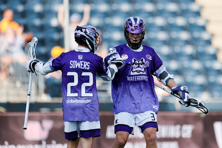 The Waterdogs' Jack Hannah (right) celebrates a goal against Chaos with Michael Sowers during last year's Premier Lacrosse League championship game at Subaru Park.