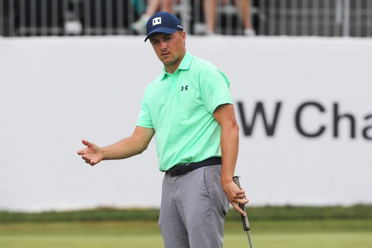 Jordan Spieth reacts to his putt on the 18th hole.