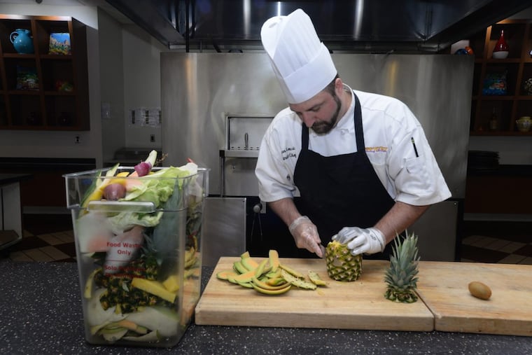 Chef Jason Lewis of West Chester University cuts fruit for lunch and saves the waste for compost. Lawrence Hall, West Chester University, West Chester, Pa. on Friday morning, June 2, 2017.
