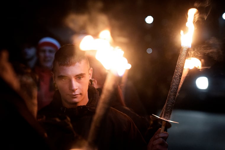 Demonstrators hold torches during a far-right Thuegida rally in Jena, Germany, in November 2016.
