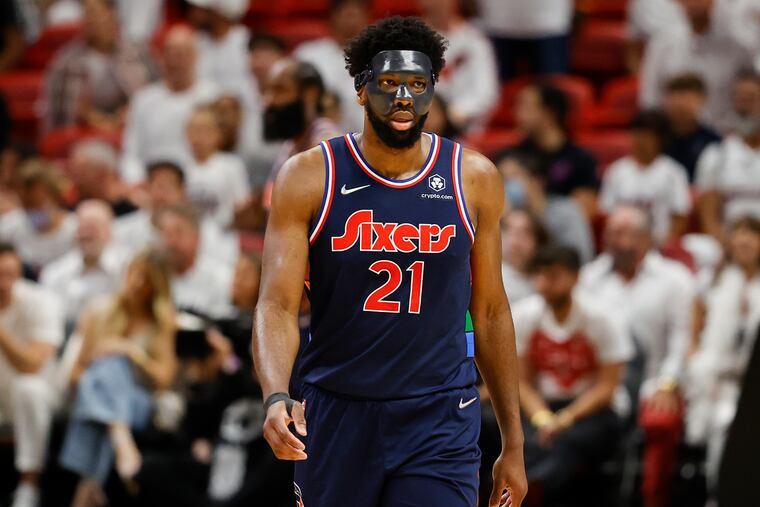 Sixers center Joel Embiid walks down court during Game 5.