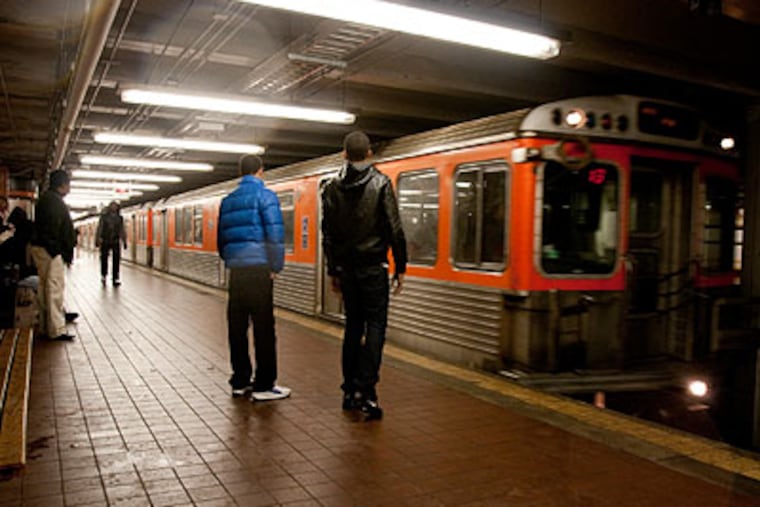 Youths on the southbound Septa platform of the Broad Street line at Hunting Park head toward Center City at 3 p.m. Friday. (Ed Hille / Staff Photographer)