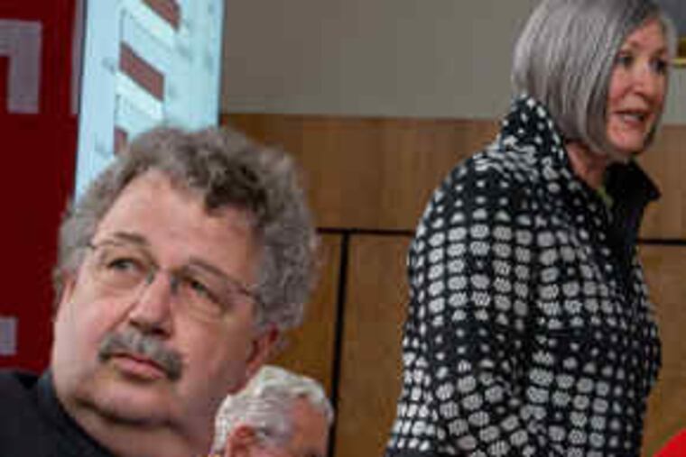 Temple University president Ann Weaver Hart addressingtrustees yesterday, including board secretary George E. Moore (left). Polett is seated behind Hart.