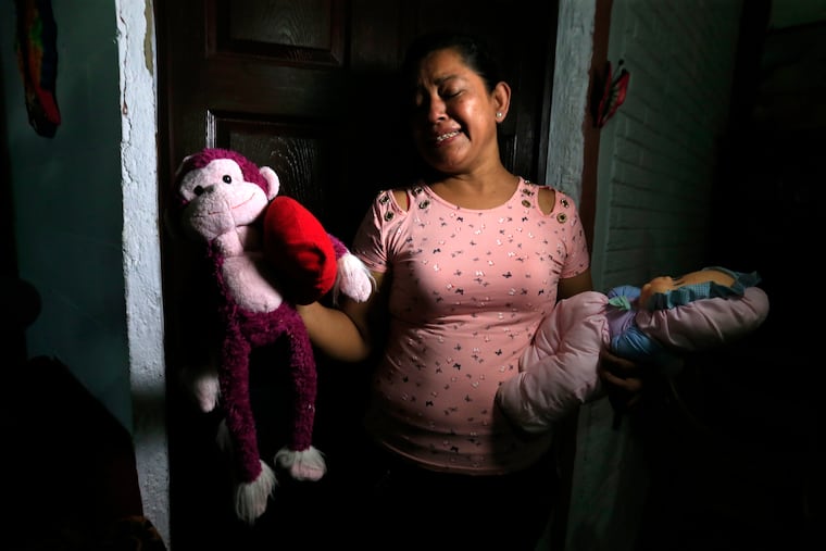 Rosa Ramirez sobs as she shows journalists toys that belonged to her nearly 2-year-old granddaughter Valeria in her home in San Martin, El Salvador, Tuesday, June 25, 2019. The drowned bodies of Ramirez's son, 25-year-old Oscar Alberto Martinez Ramirez, and his daughter were located Monday morning on the banks of the Rio Grande, a day after the pair were swept away by the current when the young family tried to cross the river to Brownsville, Texas. Her daughter-in-law Tania Vanessa Avalos, 21, survived.