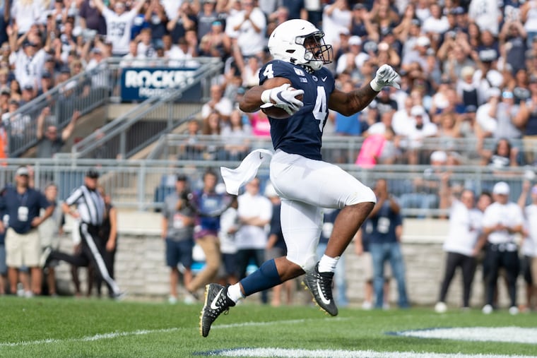 Penn State running back Journey Brown (4) celebrates his first quarter touchdown run against Idaho in their NCAA college football game in State College, Pa., on Saturday, Aug. 31, 2019. (AP Photo/Barry Reeger)